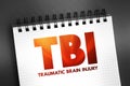 TBI Traumatic Brain Injury - intracranial injury to the brain caused by an external force, acronym text concept on notepad