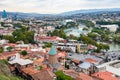 Tbilisi city with St George Church on cloudy day