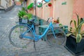 Tbilisi, Georgia, 18 December 2019 - cute blue bicycle adorns the entrance to a cafe on a narrow street in the old city