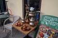 Tbilisi, Georgia, 15 December 2019 - hookah and Turkish copper dishes on a street table in a cafe