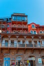 Tbilisi, Georgia, 17 December 2019 - multi level building of old town houses with carved balconies