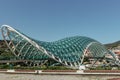 Tbilisi,Georgia-July 5,2019. The Bridge of Peace,Europe.Pedestrian bridge with steel and glass construction over the Kura River. Royalty Free Stock Photo