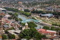 TBILISI, GEORGIA - July 16, 2014: View of the Tbilisi from Narikala Fortress. Bridge of Peace and Kura River in the Royalty Free Stock Photo