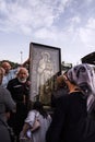 Tbilisi, Georgia: Believer piligrims praying near Orthodox Saint icon