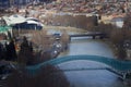 TBILISI, GEORGIA - MARCH 015, 2020: People in apark in front of Concert Hall and the Official residence of Georgian