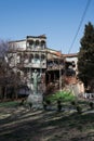 TBILISI. GEORGIA - MARCH 2020: Statue of Georgian poet of early 20 century Ietim Gurji surrounded by crumbling old traditional