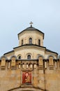 Tower with Georgian Church cross and religious portrait Holy Trinity Cathedral Tbilisi Georgia