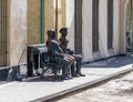 Bronze sculpture of two men sitting on a bench on Ioane Shavteli St in Tbilisi city in Georgia