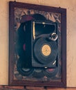 Wall decorative installation in the form of an old gramophone and vinyl records in a restaurant in Tbilisi city in Georgia