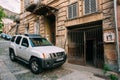 Tbilisi Georgia. Parked White Nissan Xterra SUV Car Near Ancient