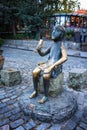 Bronze statue of sitting Tamada with wine horn on Sioni's street in old Tbilisi, Georgia.Tamada is a Georgian toastmaster at a Ge
