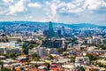 Tbilisi Georgia skyline with mixture of ancient modern and soviet era buildings under blue cloudy sky - selective focus