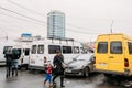 Tbilisi, Georgia. Woman And Child Walks Near Urban Taxis Minibuses Are On The Station Didube In Tbilisi, Georgia.