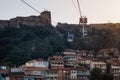 Tbilisi Old Town and Narikala Fortress on the background of the cableway at sunset Royalty Free Stock Photo