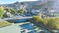 Tbilisi skyline aerial drone view from above, Kura river and old town of Tbilisi cityscape, Georgia