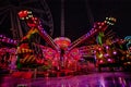 THRILL RIDES WITH COLORFUL LIGHTS Royalty Free Stock Photo