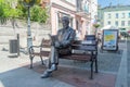 Roman Landowski on bench sculpture