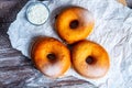 TDelicious donuts with powdered sugar on wooden table Royalty Free Stock Photo