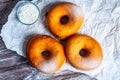 TDelicious donuts with powdered sugar on wooden table Royalty Free Stock Photo