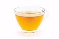 Glass cup of turmeric herbal tea isolated on white background