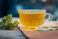 Tea of Ajwain, Trachyspermum ammi in a transparent cup with some leaves of ajwain good for health, skin and for weight loss.