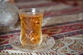 Tea in Azerbaijani traditional armudu pear-shaped glass . Azerbaijan black tea .white sugar cubes . Black turkish tea in pear Royalty Free Stock Photo