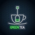 Tea bag inside a tea cup neon sign. Green tea neon Royalty Free Stock Photo