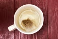 Tea bag in a white cup. Making delicious herbal tea Royalty Free Stock Photo