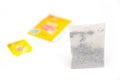 Tea bag with yellow label Royalty Free Stock Photo
