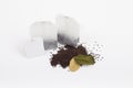 Tea bags over dried leafs leaves on background Royalty Free Stock Photo