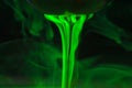 A tea ball with fluorescein in water