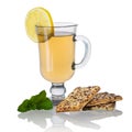 Tea with biscuits, lemon and mint isolated