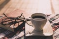 Tea and book reading time, glasses on the book Royalty Free Stock Photo