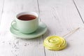 Tea break concept. Drink and sweets prepared as dessert. Mug filled with black brewed tea, spoon and heap of marshmallow Royalty Free Stock Photo