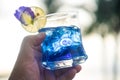 Tea from butterfly pea flower in a transparent glass with a slice of lemon Royalty Free Stock Photo