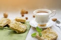 tea, cakes, chocolate pieces, halva on table Royalty Free Stock Photo