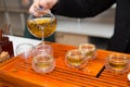 tea ceremony. a man pours tea from a glass teapot. Chinese traditions. green tea Royalty Free Stock Photo