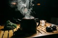 Tea ceremony. The man pours hot chinese tea into the tea cup Royalty Free Stock Photo