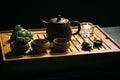 Tea ceremony. The man pours hot chinese tea into the tea cup