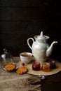 Tea ceremony with oatmeal biscuits and jam. Porcelain kettle Royalty Free Stock Photo