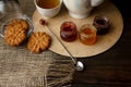 Tea ceremony with oatmeal biscuits and jam. Porcelain kettle Royalty Free Stock Photo