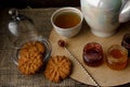 Tea ceremony with oatmeal biscuits and jam. Porcelain kettle Royalty Free Stock Photo