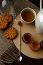 Tea ceremony with oatmeal biscuits and jam. Porcelain kettle Royalty Free Stock Photo
