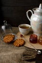 Tea ceremony with oatmeal biscuits and jam. Porcelain kettle Royalty Free Stock Photo