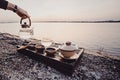 Tea ceremony on the river bank Royalty Free Stock Photo