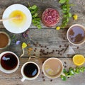 Tea, coffee, cocoa in cups, chicory, lemon, mint, jam made of rose petals, dried lime, honey Royalty Free Stock Photo