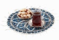 Tea and cookies, served on the qalamkar platemat. Royalty Free Stock Photo
