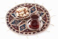 Tea and cookies, served on the qalamkar platemat. Royalty Free Stock Photo
