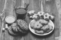 Tea and cookies on wooden background. Hot beverage and pastry concept. Glass of black tea Royalty Free Stock Photo