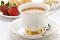 Tea with cruller and strawberries Royalty Free Stock Photo